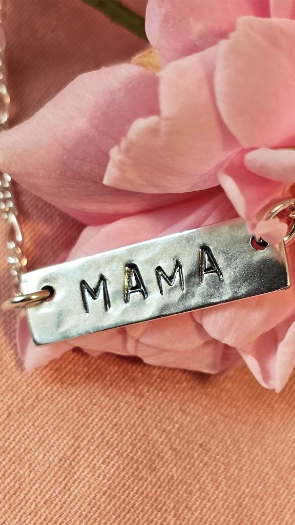 mama metal tag on pink flower